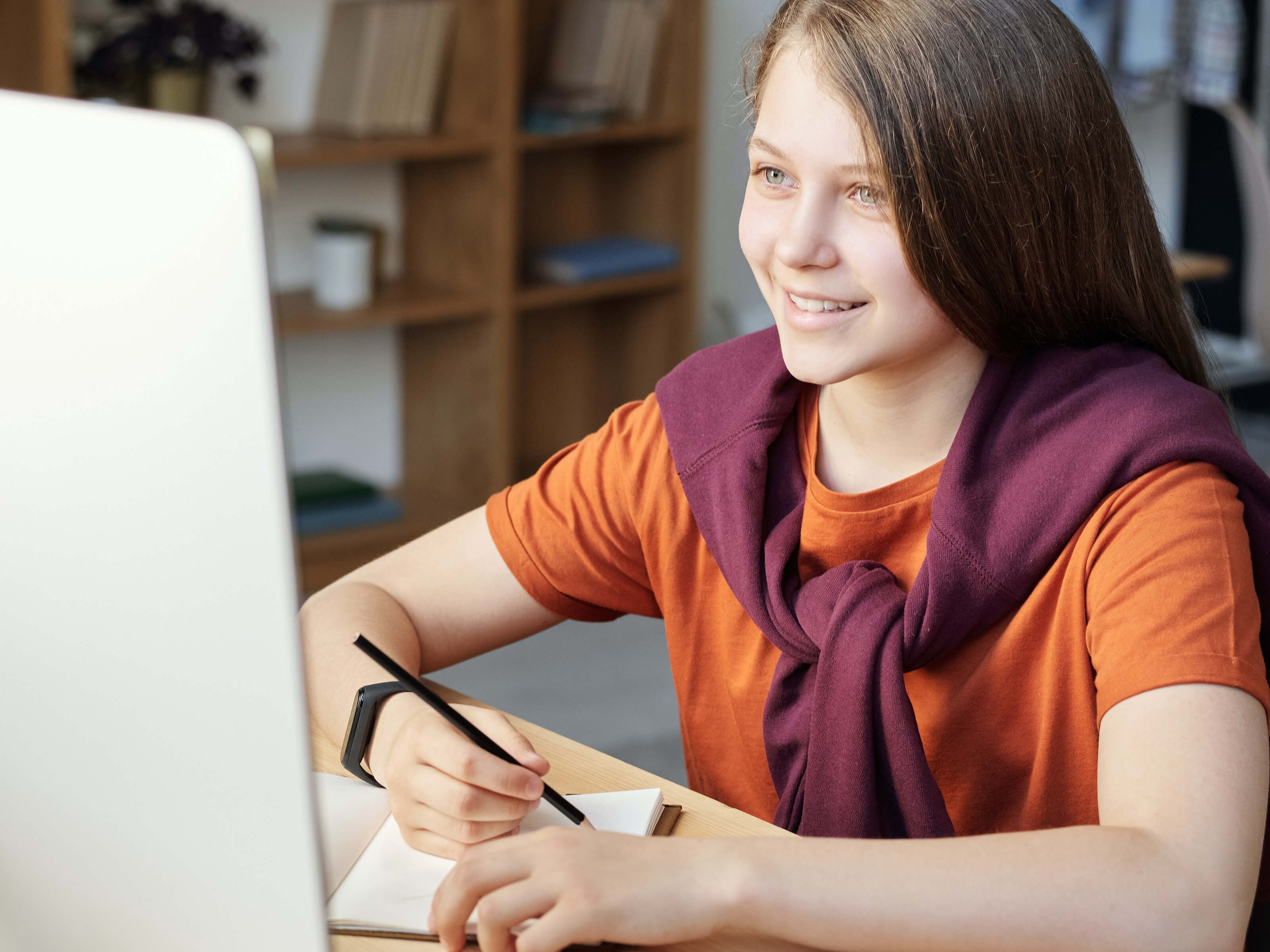Girl being tutored online.